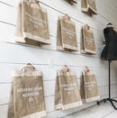Apolis is your year-round staple—an elevated travel keepsake and symbol of shopping local. Collected across thousands of neighborhoods, each bag is special to your shop and highlights your place in the world.